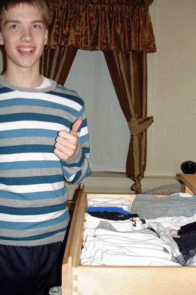 student with tidy drawer