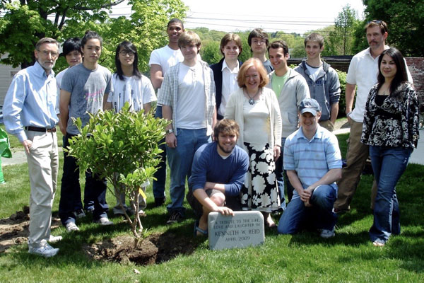 students and dorm parents at tree planting