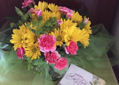 Flower arrangement with Happy Easter card