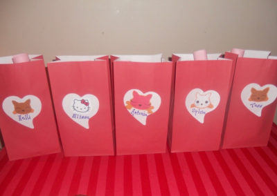 Five red paper bags