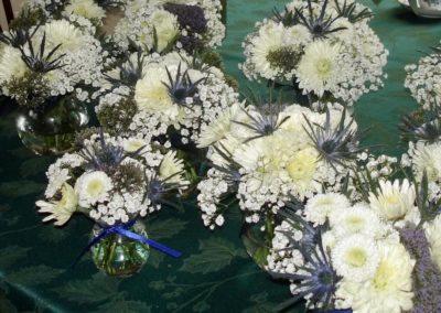 Numerous white Flower arrangements