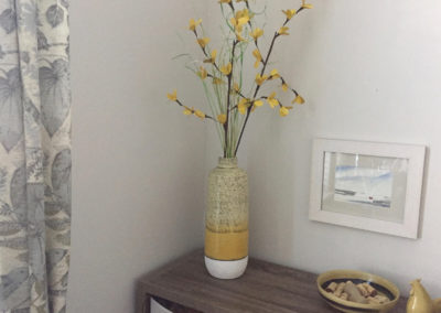 Tall vase with flower arrangement